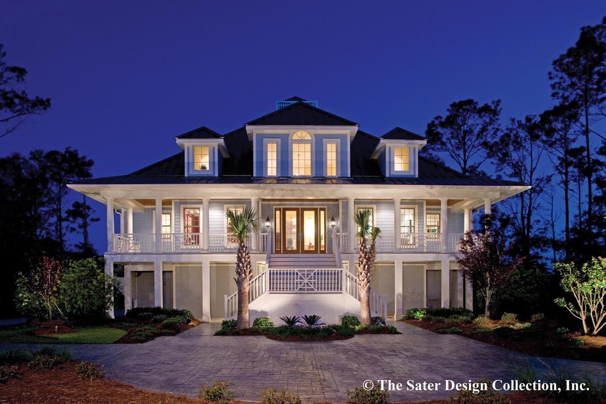 House plan exterior with two stories, a wraparound porch, dormers, and a gabled roofline. Features include a raised foundation and symmetrical design.