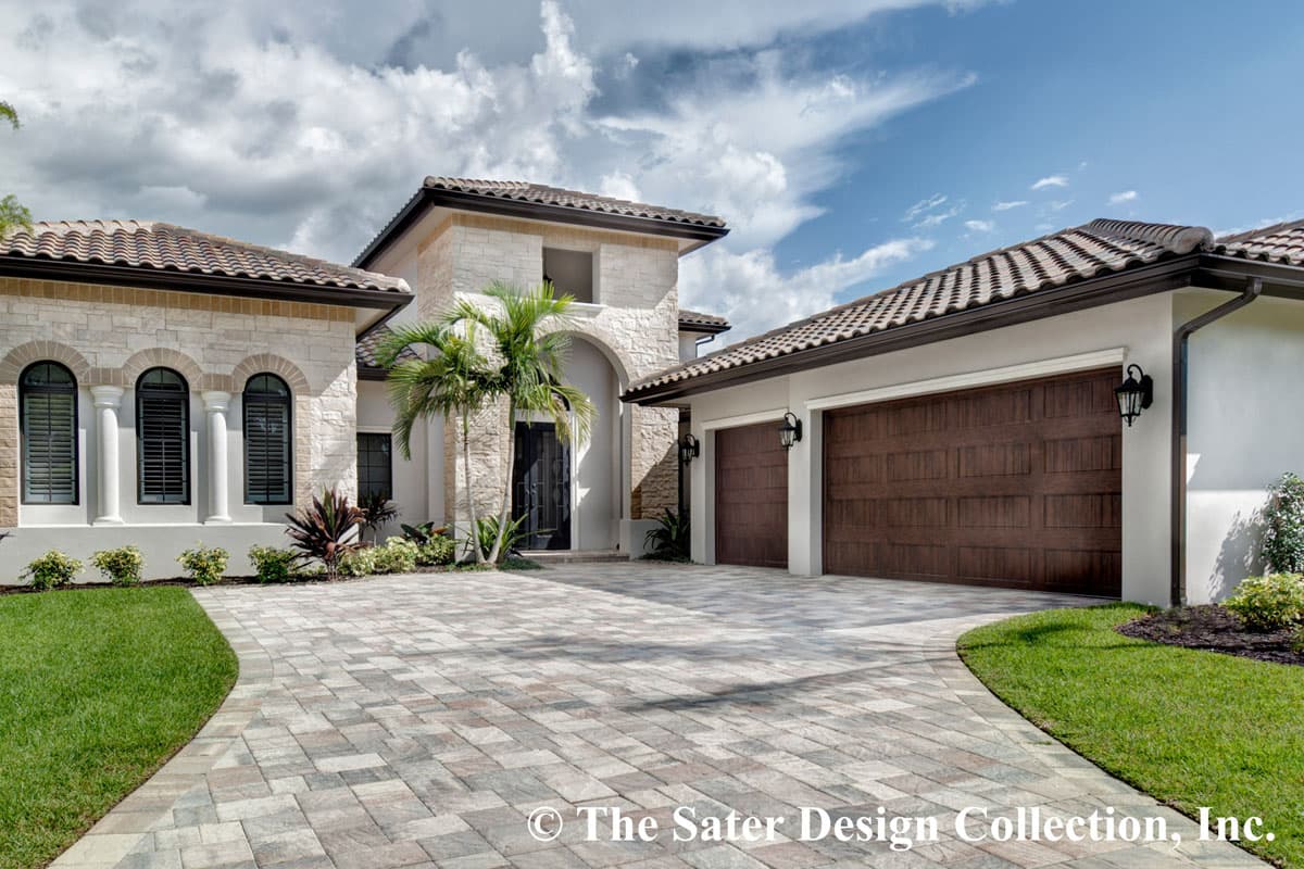 House plan exterior with arched windows, stone accents, tile roof, and a three-car garage.