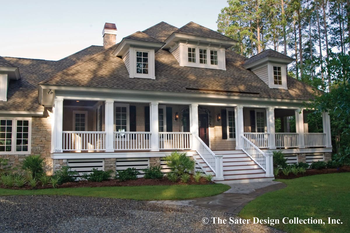 House plan exterior. Two-story Craftsman home with a covered porch supported by columns. Features include gabled roof and dormers.