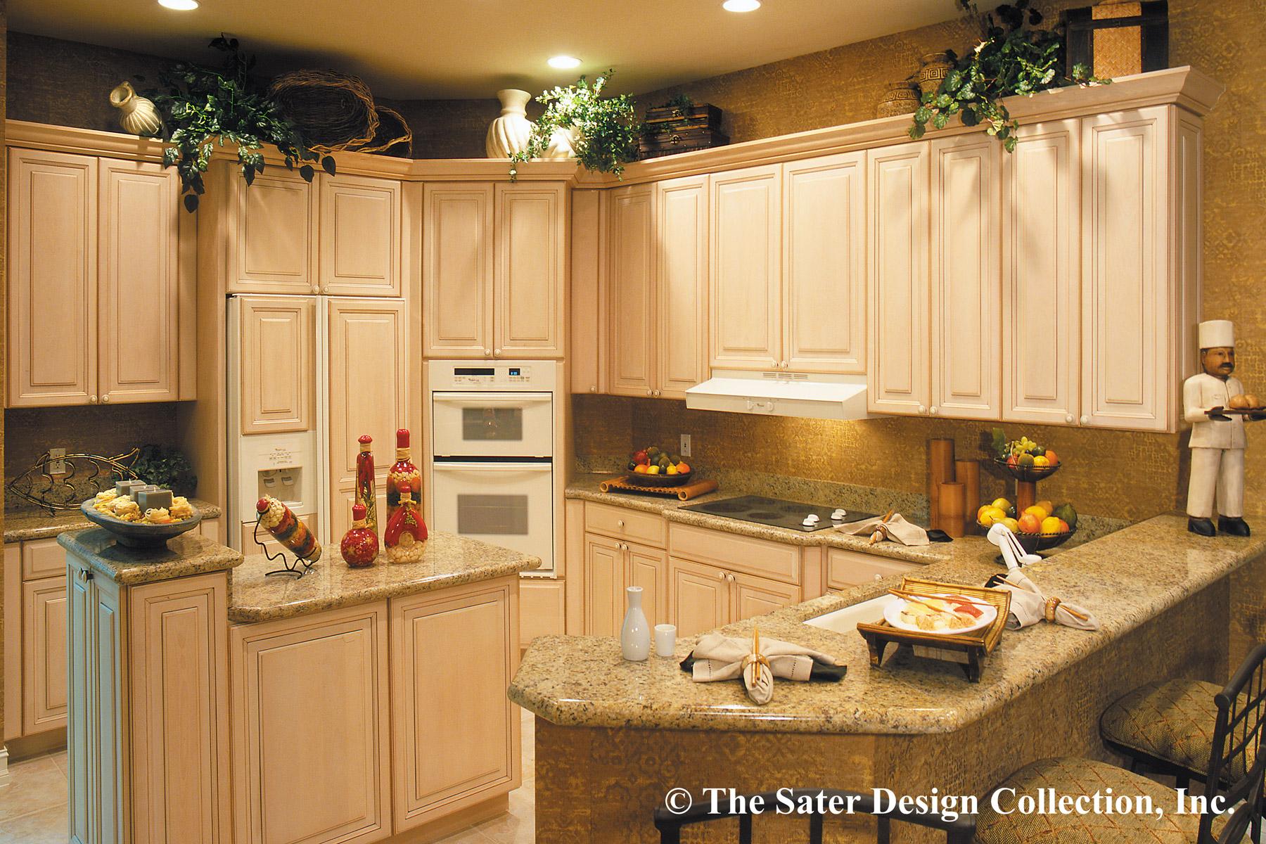 Kitchen with light wood cabinetry, granite countertops, double oven, cooktop, island with seating, and decorative accents.