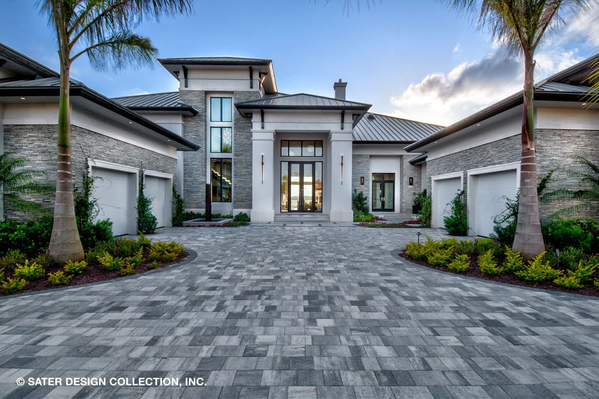 Modern house plan exterior with stone accents, metal roof, dual garages, and grand entryway with double glass doors.