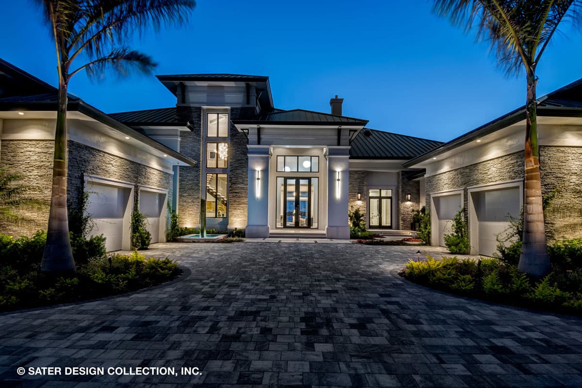 House plan exterior featuring a modern design with stone facade, multiple garages, and a prominent entryway with tall windows.