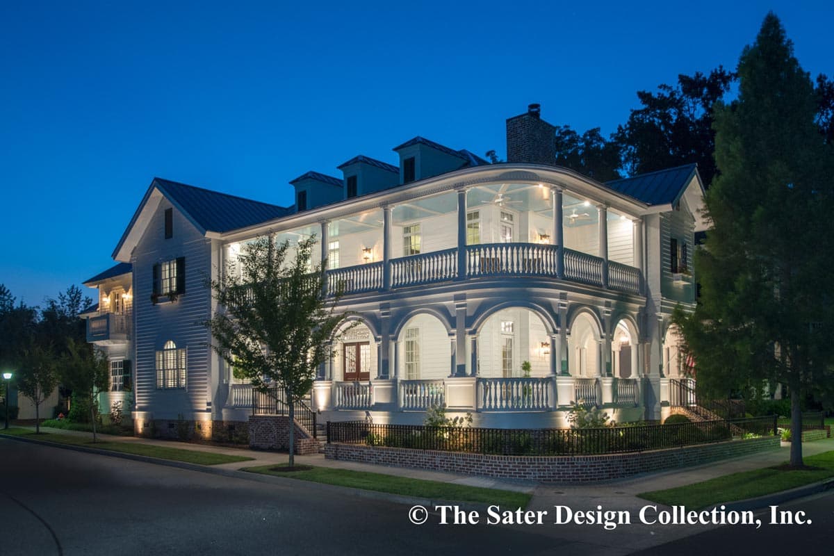 House plan exterior: Two-story home with a wraparound porch, multiple gables, and dormers.