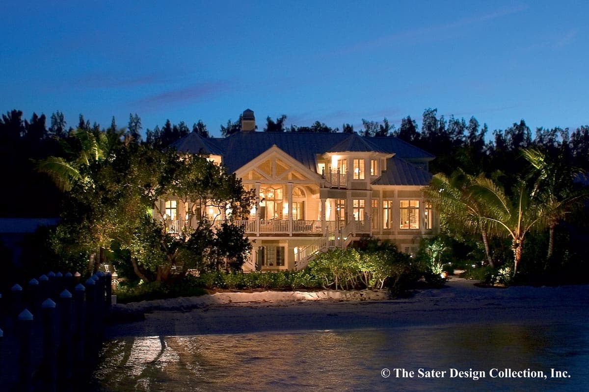 House plan exterior: Two-story home with multiple gables, wraparound balconies, and prominent central entryway.