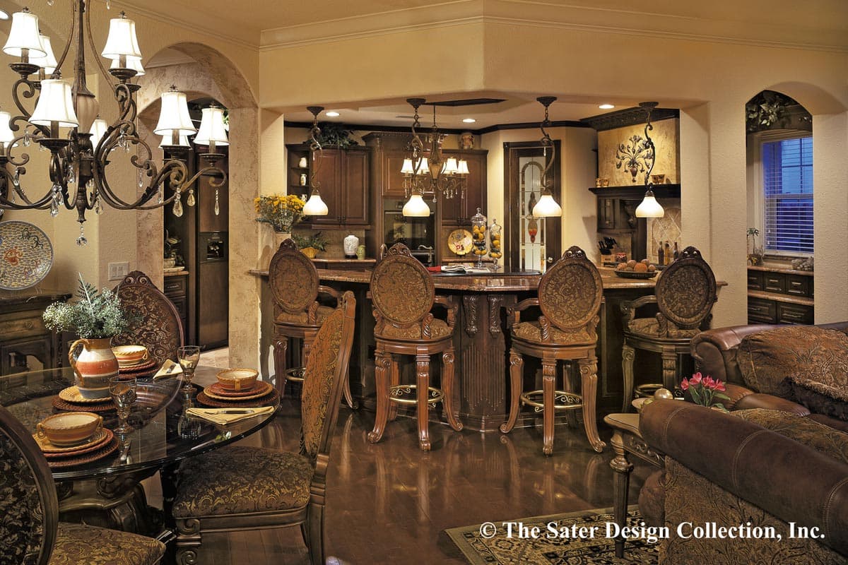 Interior view of a home showing a dining area, kitchen with bar seating, and a living area with leather sofa.