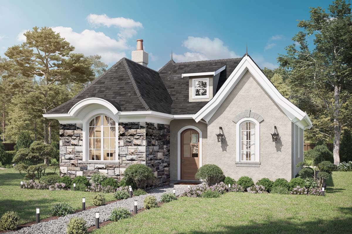House plan exterior featuring a stone and stucco facade, arched windows, a steeply pitched roof, and decorative finials.