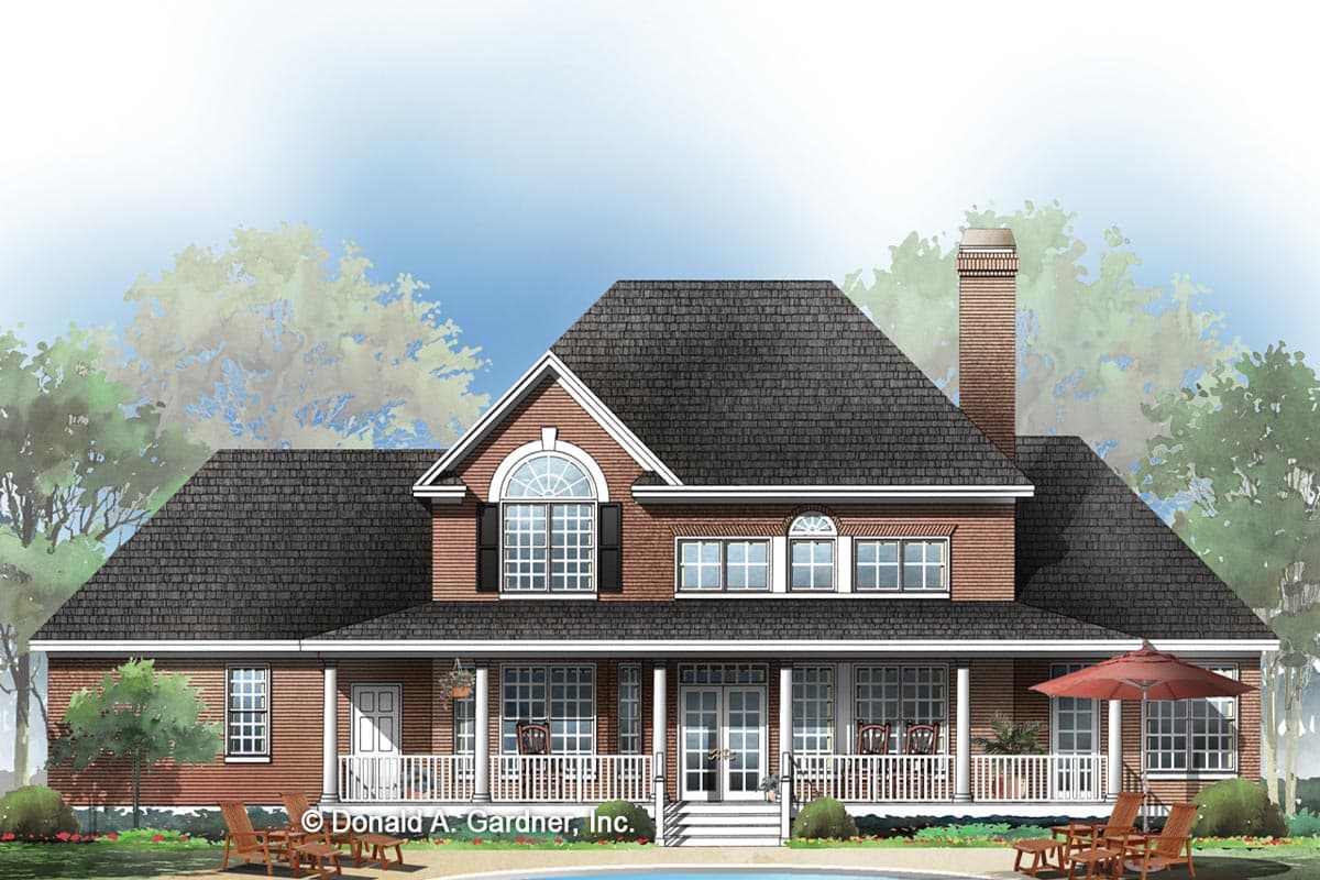 House plan exterior showing a two-story brick home with a wraparound porch, central gable with arched window, and a prominent chimney.