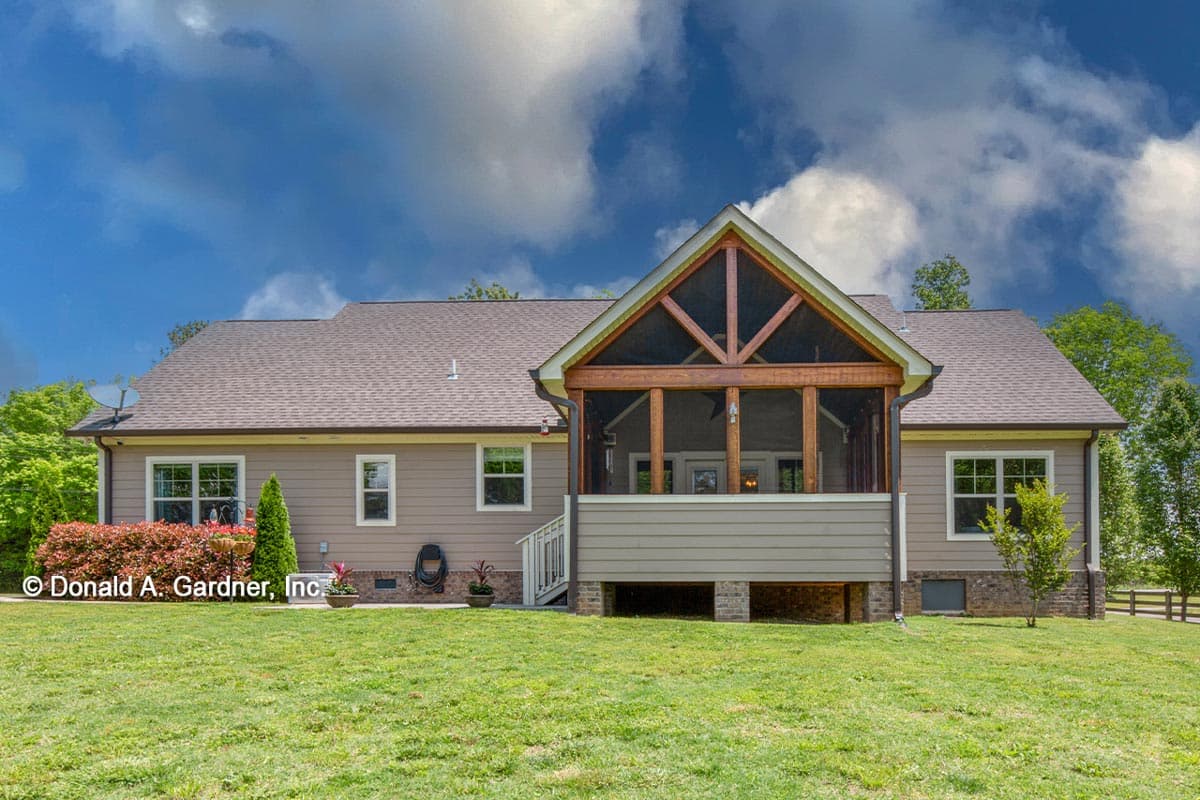 House plan exterior: Ranch style with screened porch featuring exposed wooden beams, multiple windows, and gable roofline.