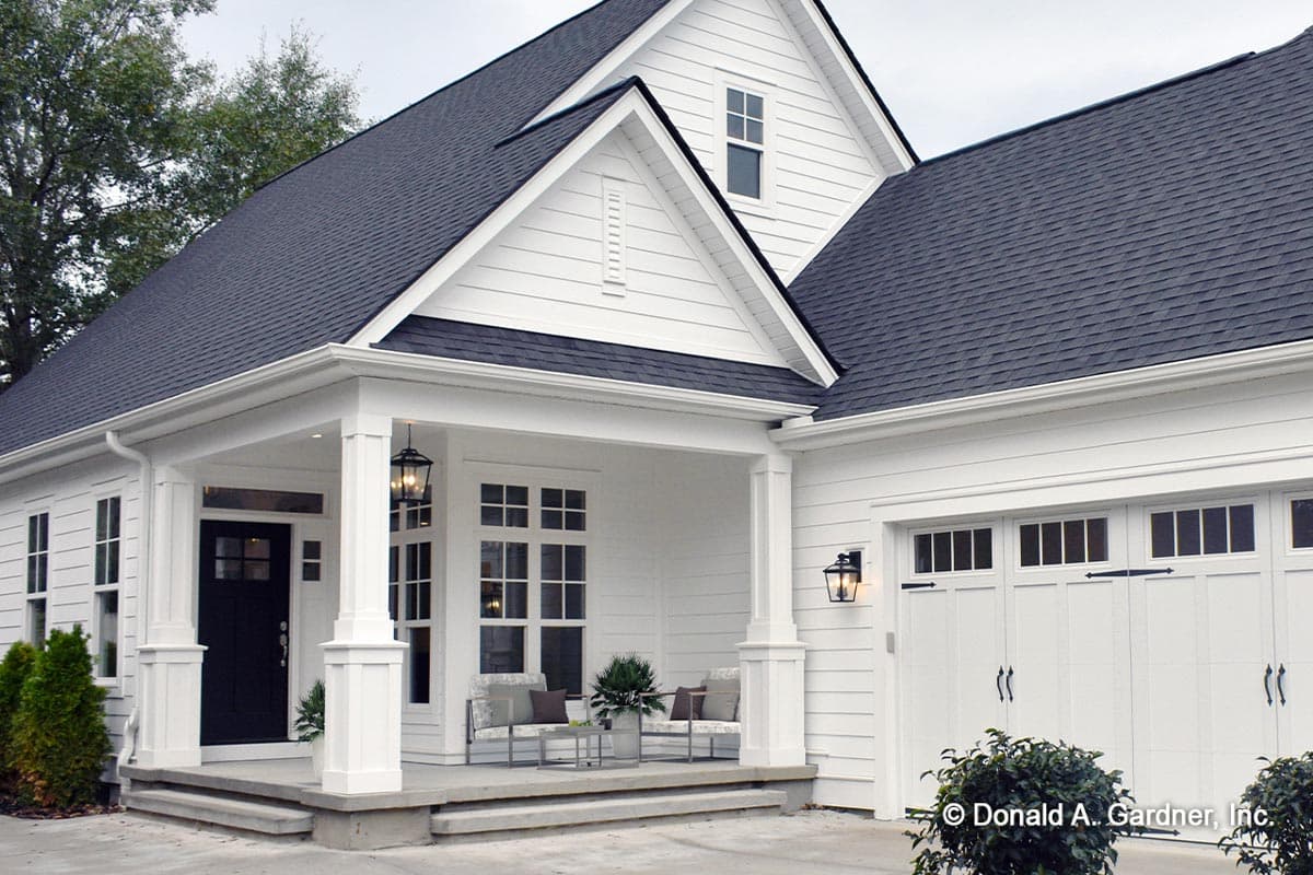 Modern Farmhouse house plan exterior with covered front porch, gable, and two-car garage.