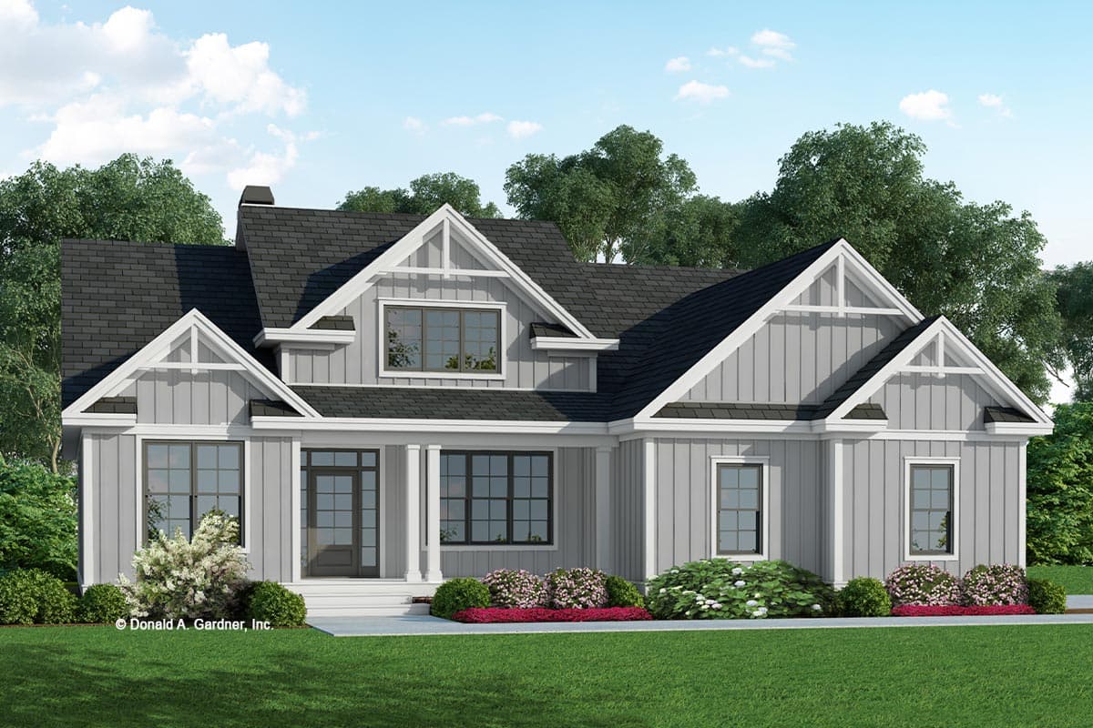 House plan exterior with two stories and gabled roof. Features include a front porch with columns and multiple gables with decorative trim.