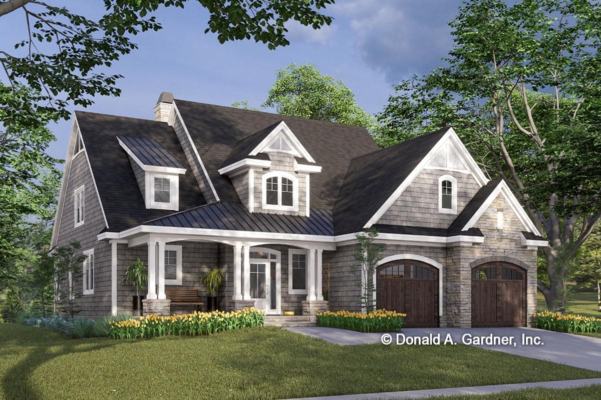 House plan exterior. Two-story Craftsman home with a front porch, gables, dormers, and a two-car garage with arched garage doors.
