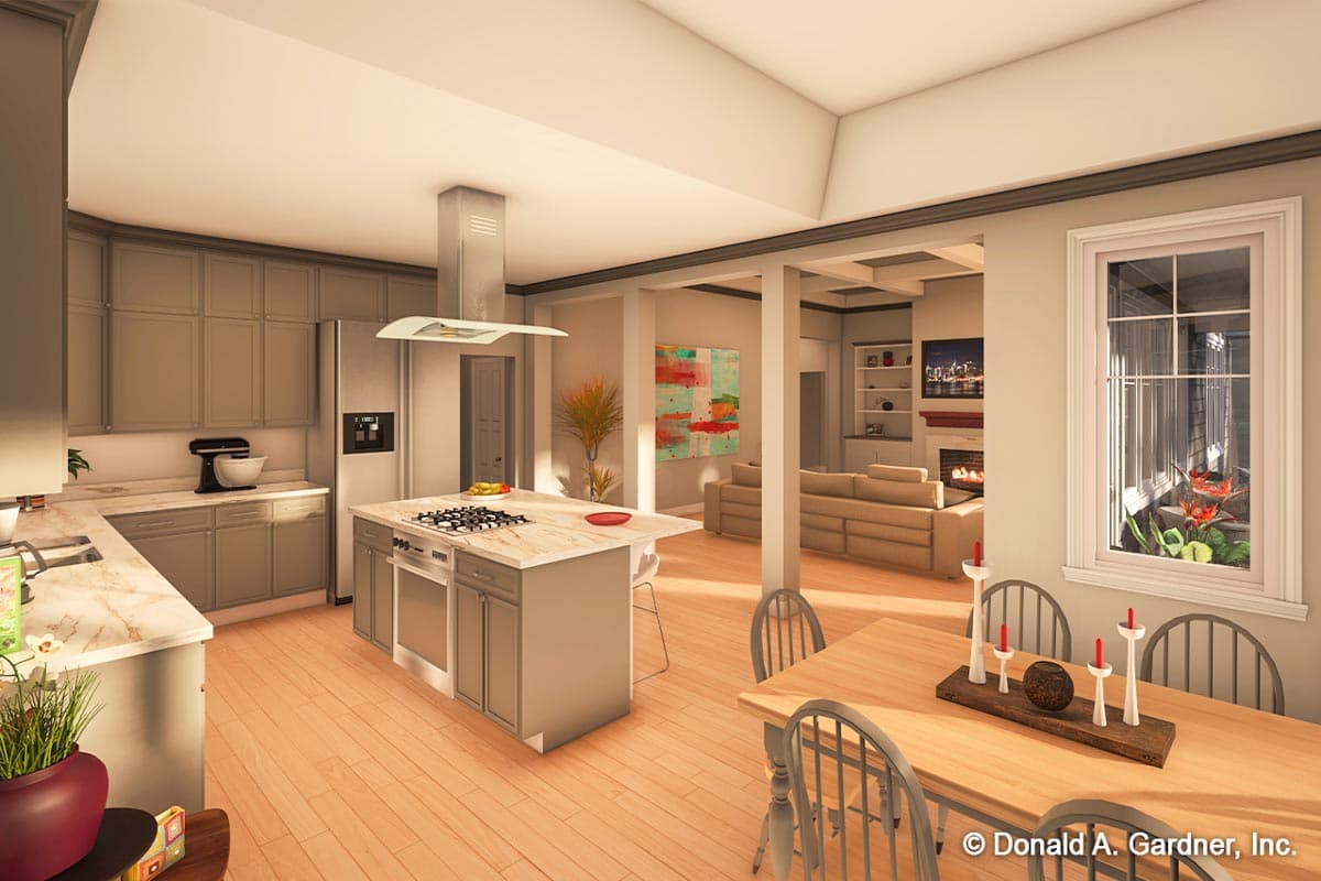 Modern home interior view of a kitchen with island, dining area, and living room with fireplace.