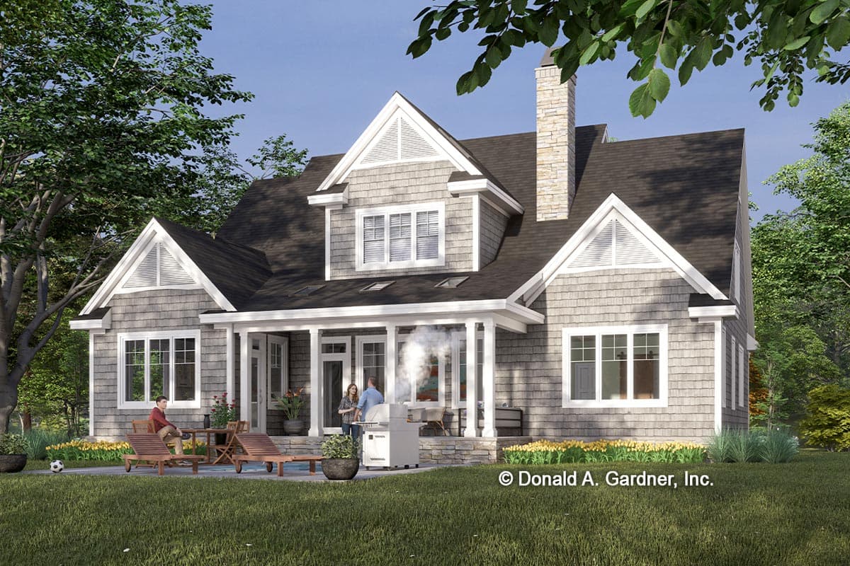House plan exterior featuring a two-story Modern Farmhouse design with shake siding, a large covered porch, multiple gables, and a stone chimney.
