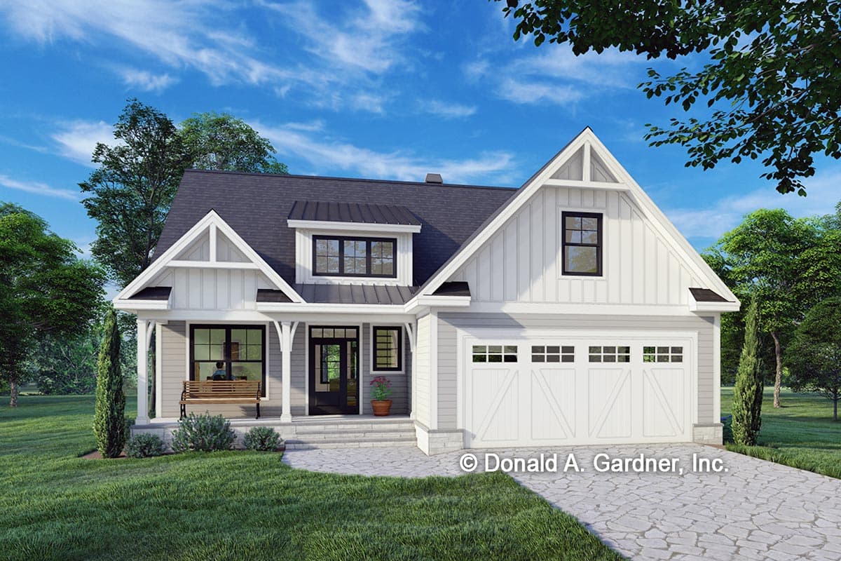 House plan exterior. Two-story Modern Farmhouse with gabled roof, dormers, a front porch, and an attached garage with a carriage-style door.