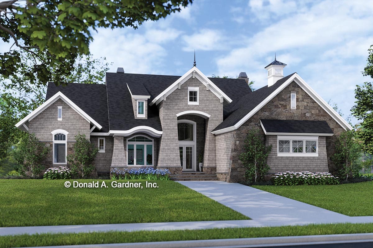 House plan exterior with two stories, gabled roof, stone and shingle siding, dormers, and an arched entry.