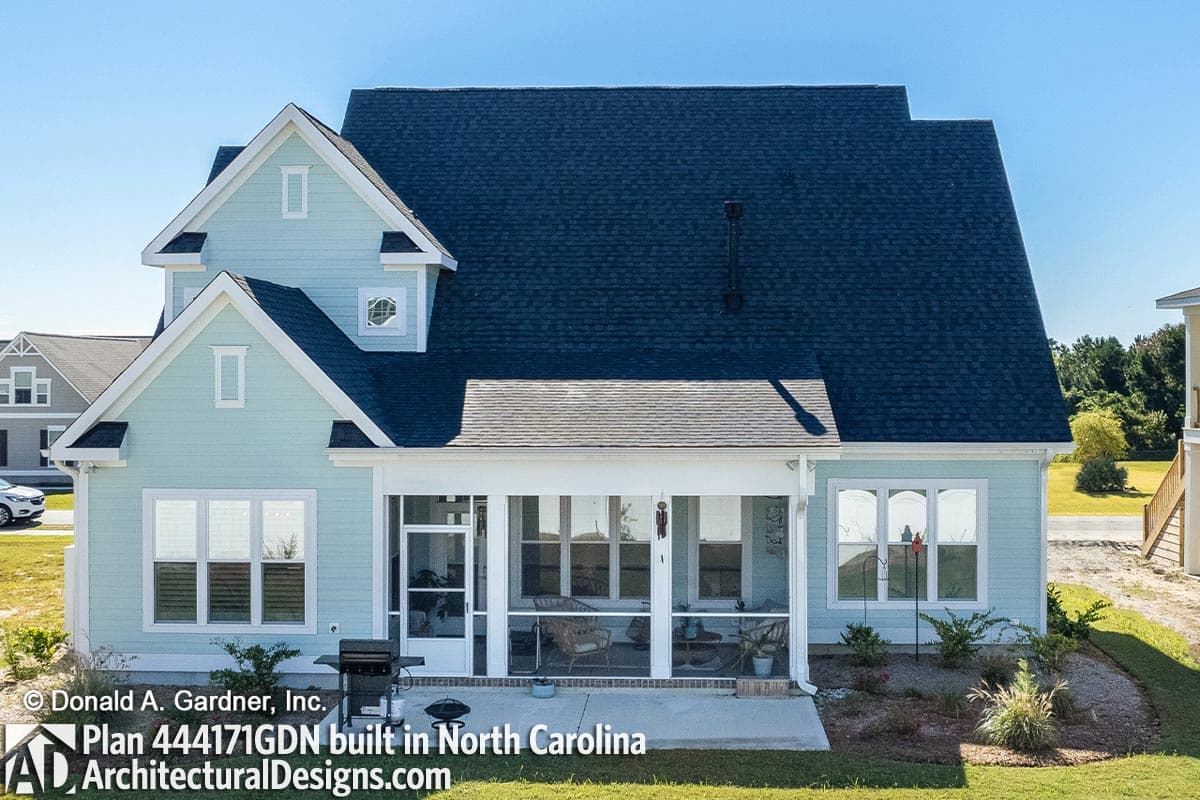 House plan exterior with light blue siding, gables, dormers, and a screened porch.