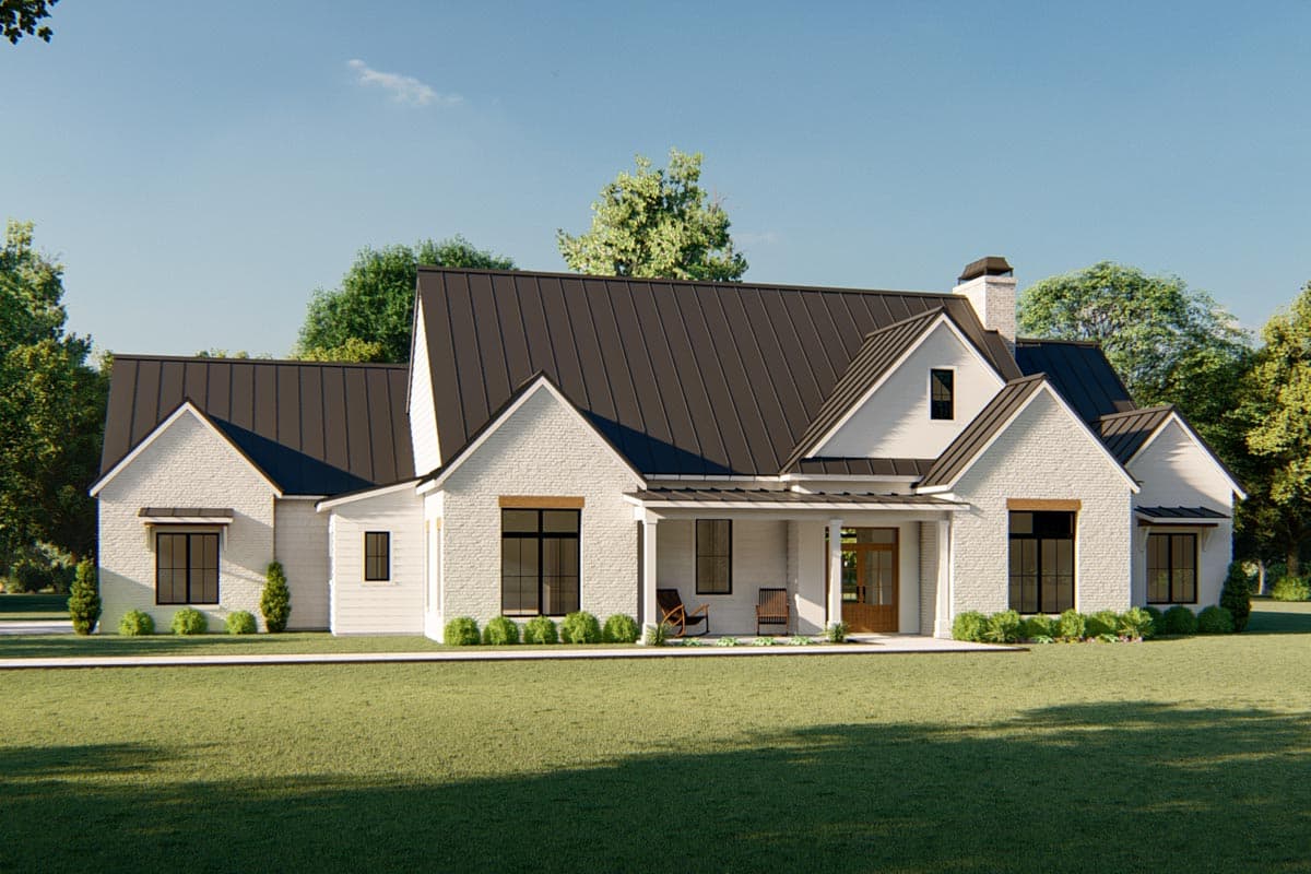 Modern Farmhouse exterior with white brick, metal roof, front porch, gables, and chimney.