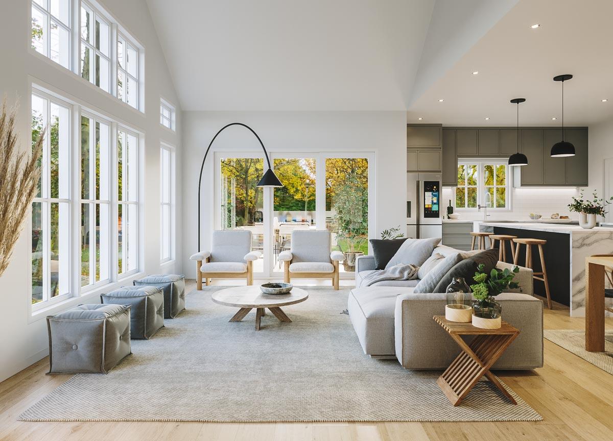 Living area and kitchen with vaulted ceiling, large windows, island, and modern cabinetry.
