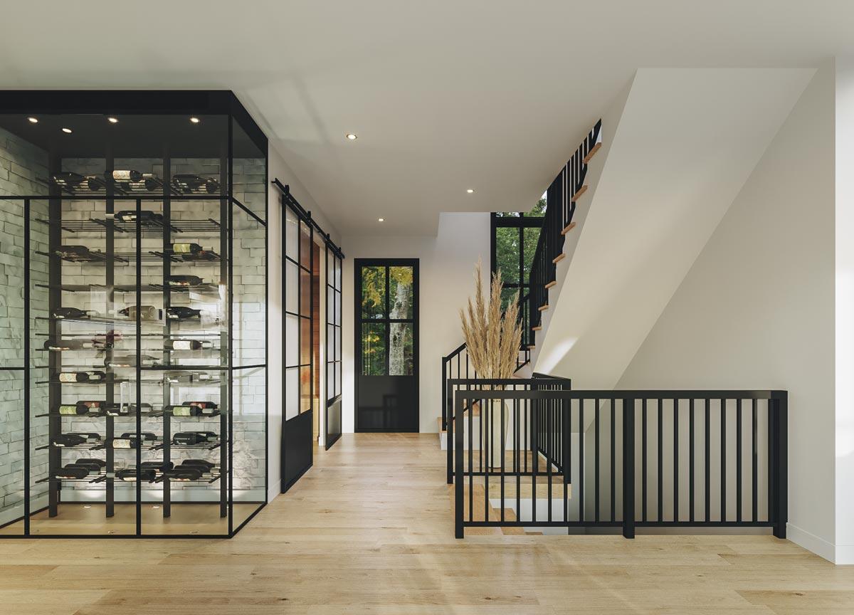 Interior rendering of a modern entryway with a glass wine cellar, sliding barn door, and staircase with black railing.