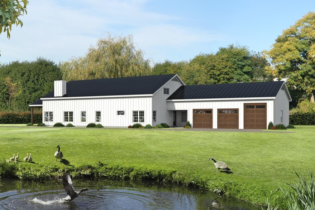 Modern Farmhouse house plan exterior with white board and batten siding, black metal roof, and a three-car garage.