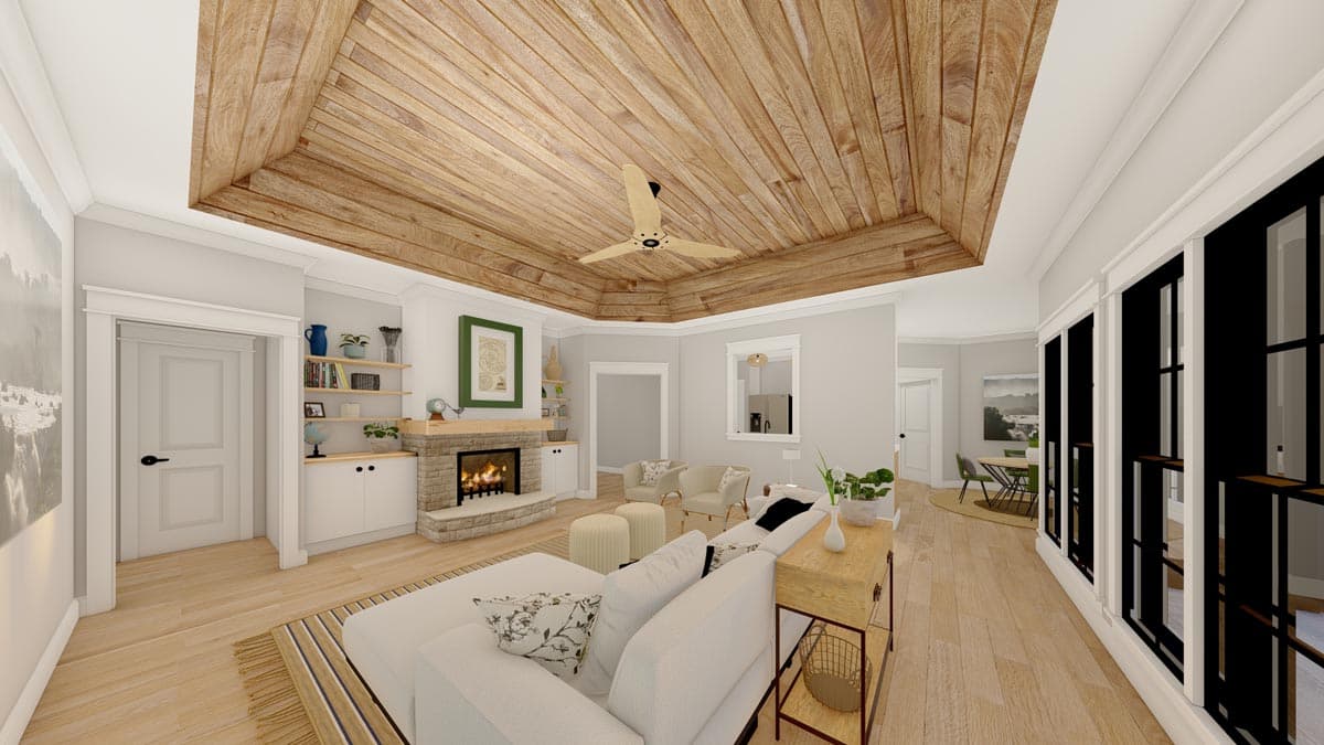 Great room with wood plank coffered ceiling, stone fireplace, built-in shelving, and large windows.