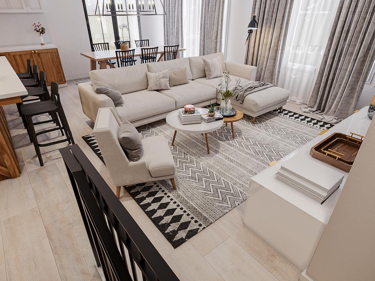 Living room with sectional sofa, coffee table, dining area with table and chairs, and kitchen island with bar stools.