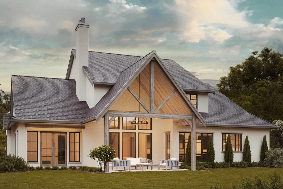 Modern Farmhouse house plan exterior with gabled dormer, prominent chimney, and covered patio with exposed wood beams.
