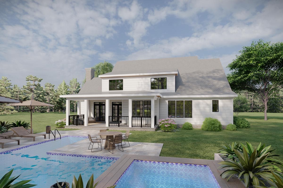 Modern Farmhouse house plan exterior with gabled dormers, a wide covered porch with black railings, and white siding.