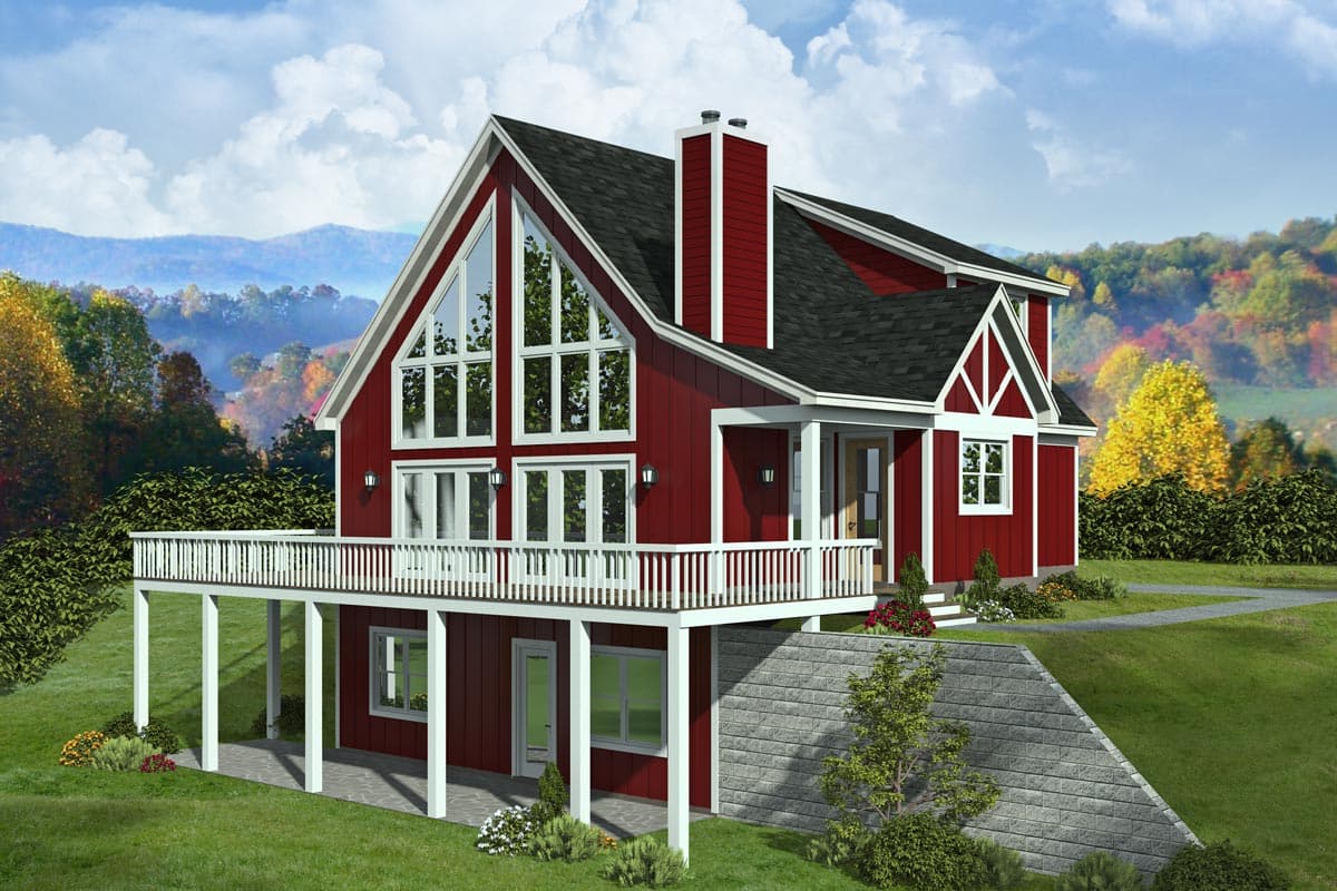 House plan exterior of a two-story red house featuring a large wrap-around deck, prominent gable with multi-pane windows, and a stone retaining wall.