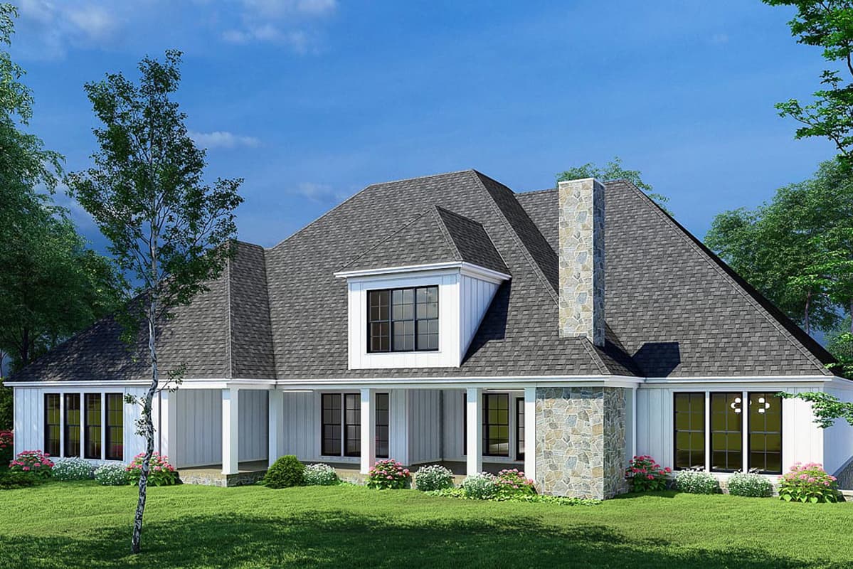 House plan exterior view of a one-story home with a large stone chimney, covered porch, and multiple gables.