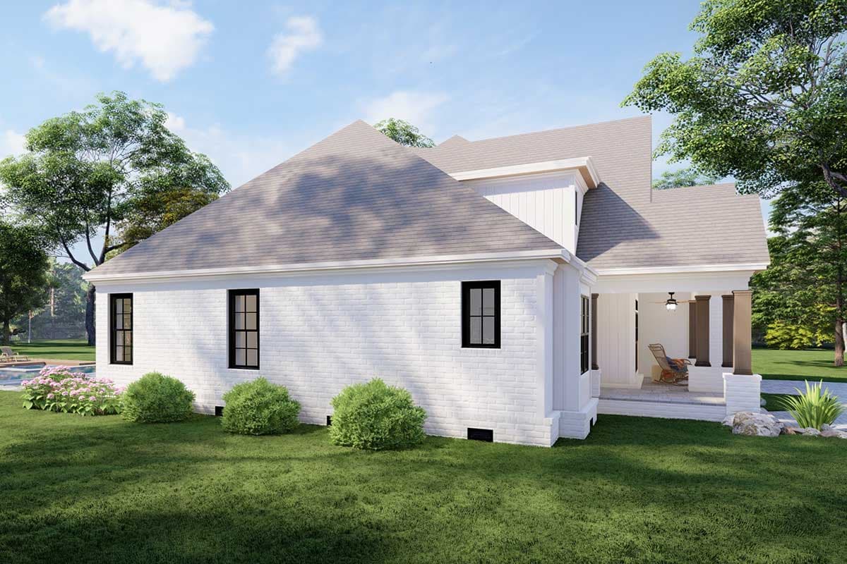 House plan exterior: one-story white brick home with a covered front porch supported by pillars, multiple gables, and dark-framed windows.