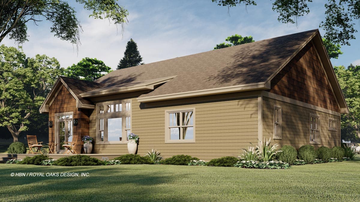 House plan exterior: one-story, side view, featuring a wrap-around porch, gabled roof, and wood shingle accents.