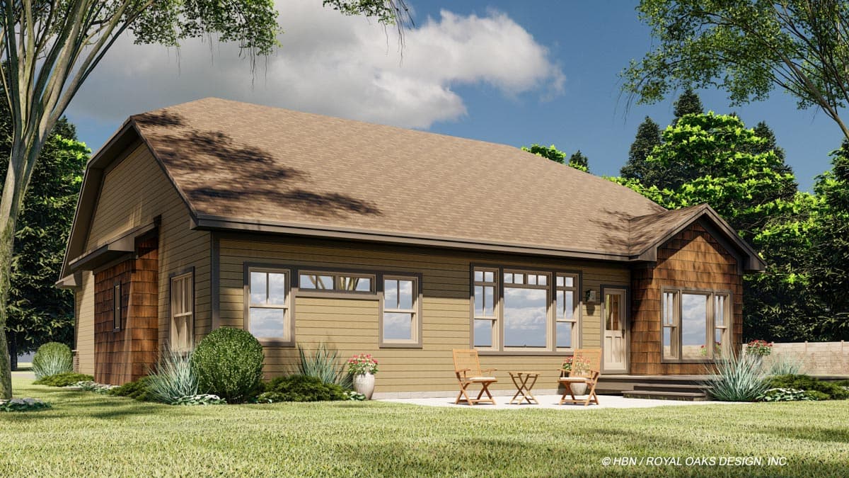Ranch house plan exterior with horizontal siding, wood shakes on gable end, multiple windows, and a rear deck.