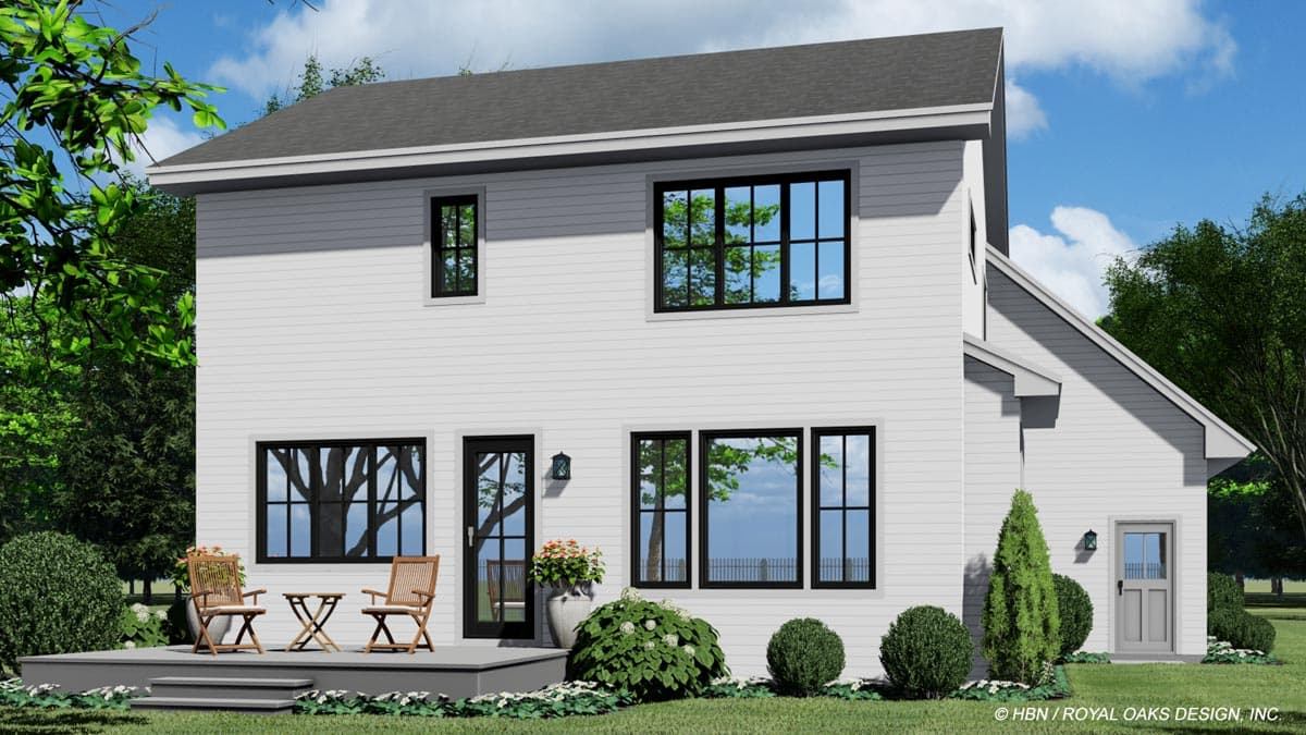 House plan exterior: Two-story home with gabled roof, patio, and multiple windows. Features a small front door on the right.