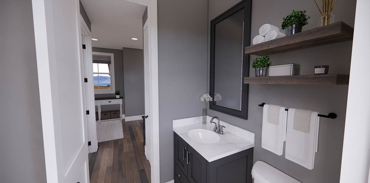 A modern bathroom interior with a gray vanity, mirror, and open doorway to a hallway with a window overlooking a scenic view.