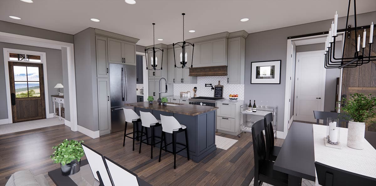 A modern, open-plan kitchen featuring gray cabinetry, a central island with bar stools, and dark wooden floors leading into a dining area.