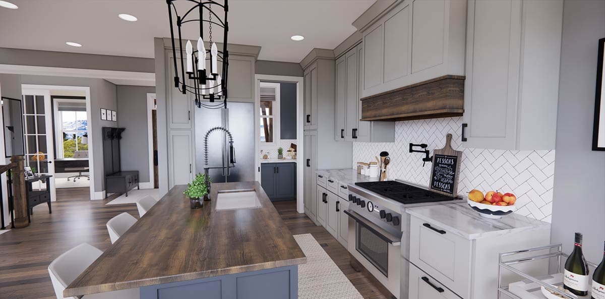 A modern kitchen with gray cabinets, a large island with a wooden countertop, and a stainless steel range. Natural light enters from adjacent rooms.