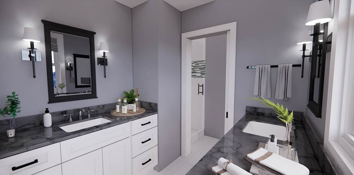 Modern bathroom with gray walls, white cabinets, and a black-framed mirror. A shower area is visible, with a towel rack and decor.