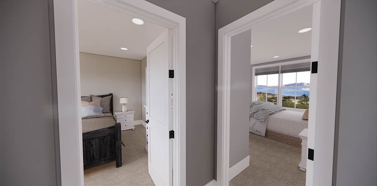 A hallway reveals two bedrooms. One has a dark bed frame and nightstand with a lamp. The other has a bed next to a window with a mountain view.