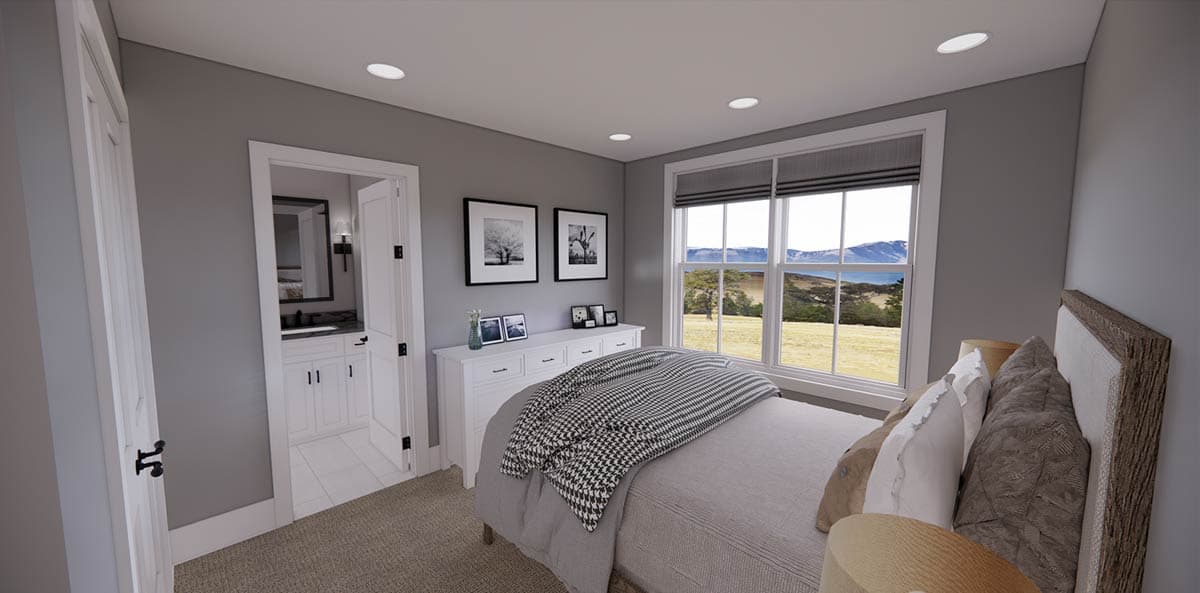 A modern bedroom with a large window overlooking a landscape. Includes a bed, white dresser with art, and an open doorway to a bathroom.