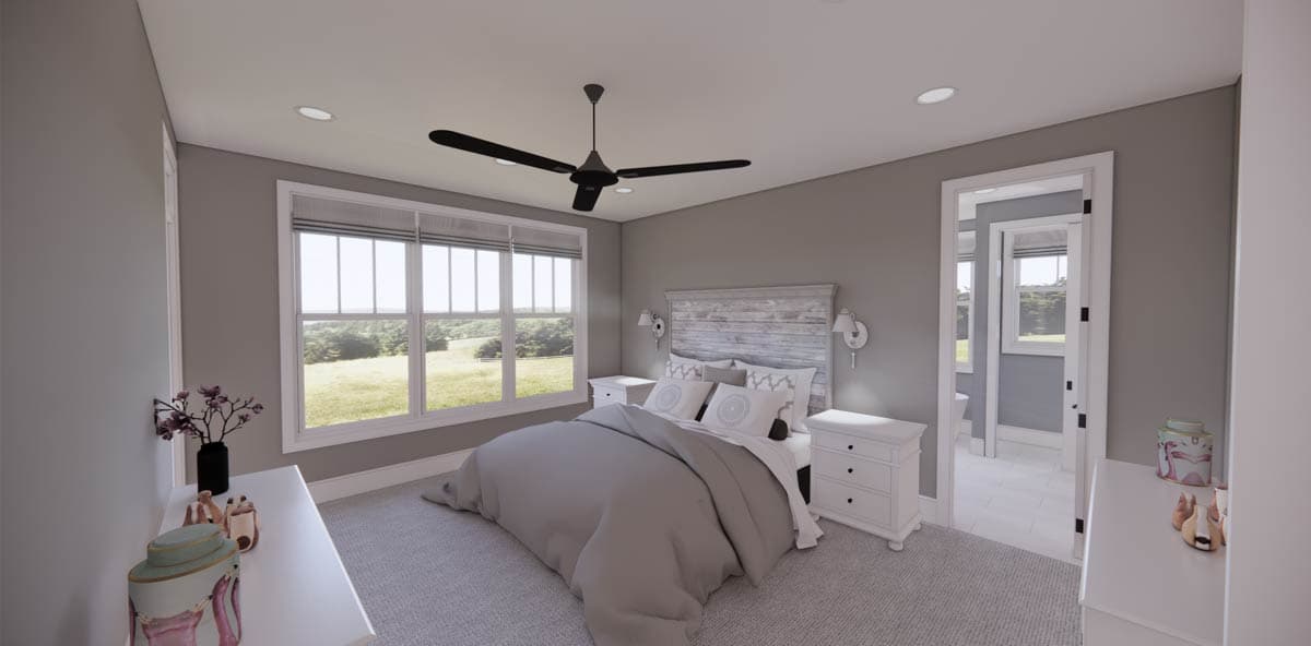 A modern bedroom with gray walls, a bed with a light-colored headboard, and a large window overlooking a green landscape.