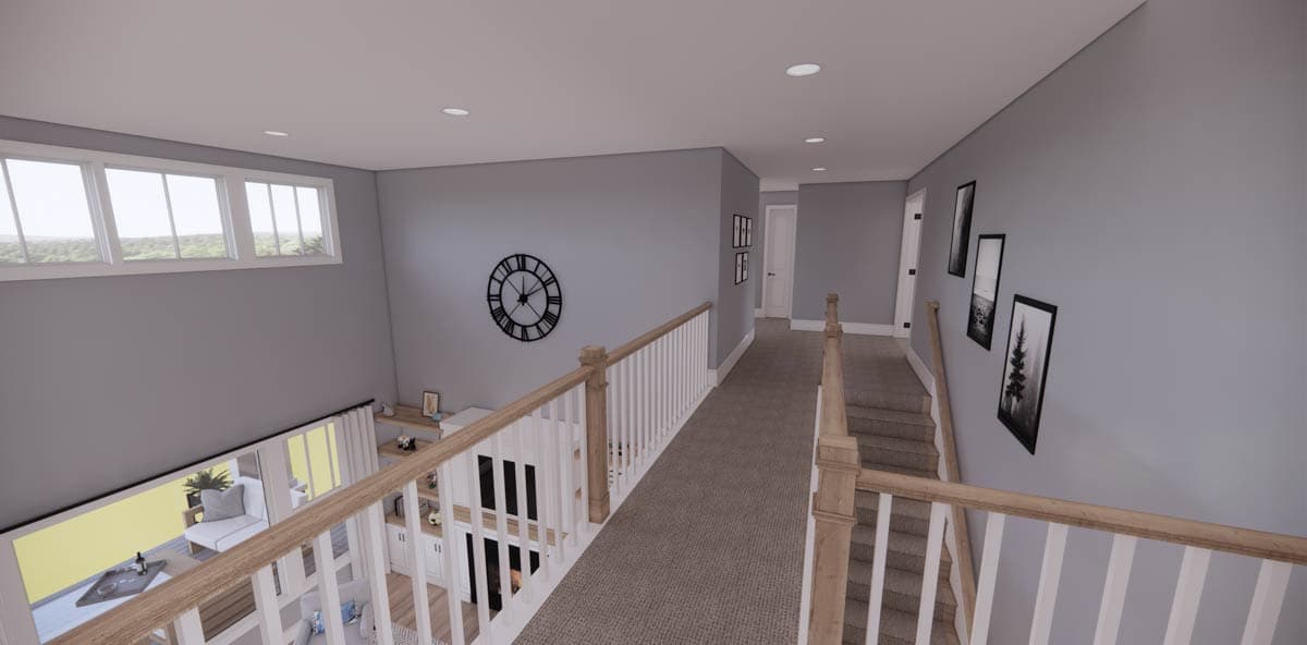 Interior view of a modern hallway, featuring a staircase, artwork, and a large clock on the wall. Natural light streams from the windows.