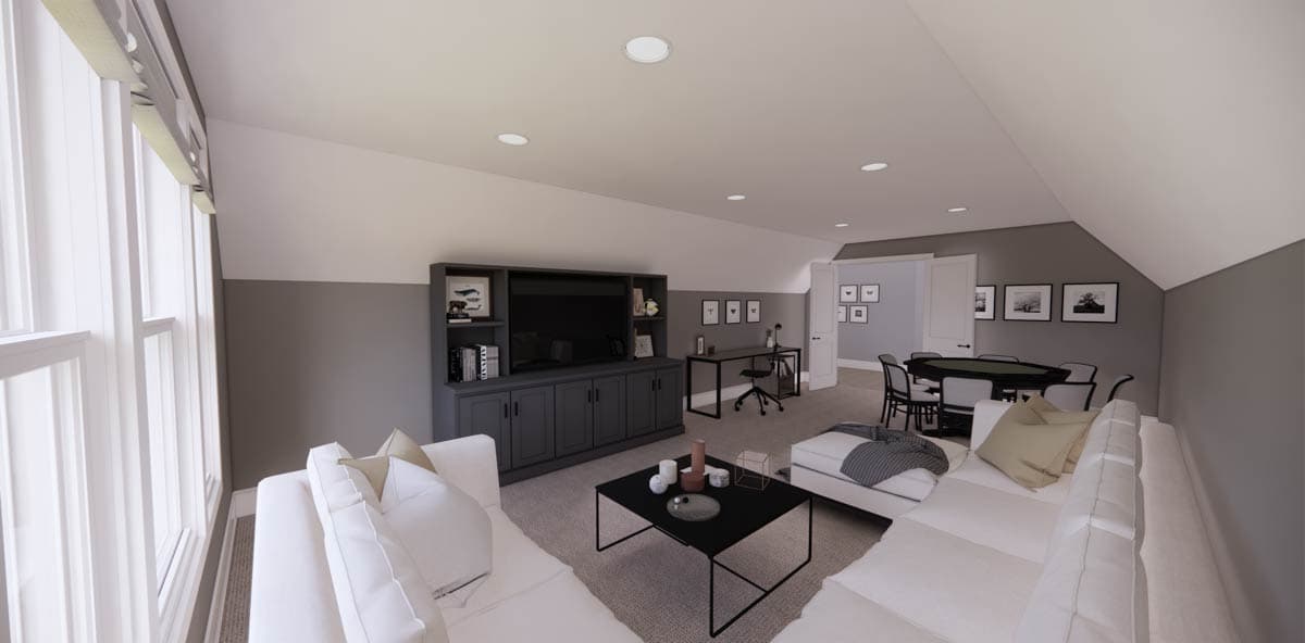 A modern, open-concept living space with a large white sectional, dark gray built-ins, and a gaming table. Soft lighting throughout.