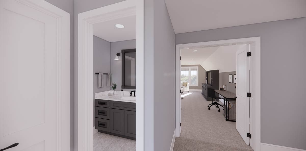 A hallway opens to a bathroom and an office space. The bathroom features a dark gray vanity, while the office has a desk and a black chair.