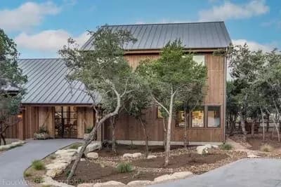 Barn-like House Plan with 2-Story Living Space and Master Suite with Private Courtyard