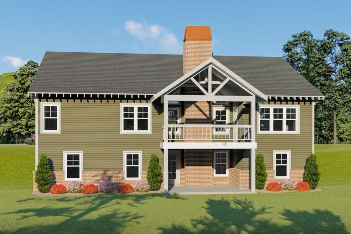 House plan exterior: Two-story home with siding, gable roof, brick foundation, and covered upper balcony with a prominent chimney.