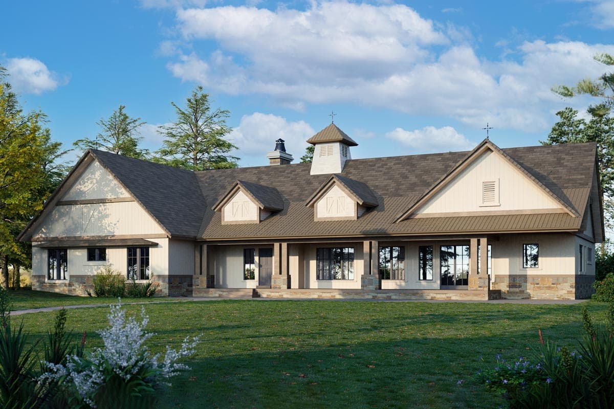 House plan exterior. One-story farmhouse with a covered porch, gabled roof, dormers, and cupola on roofline.