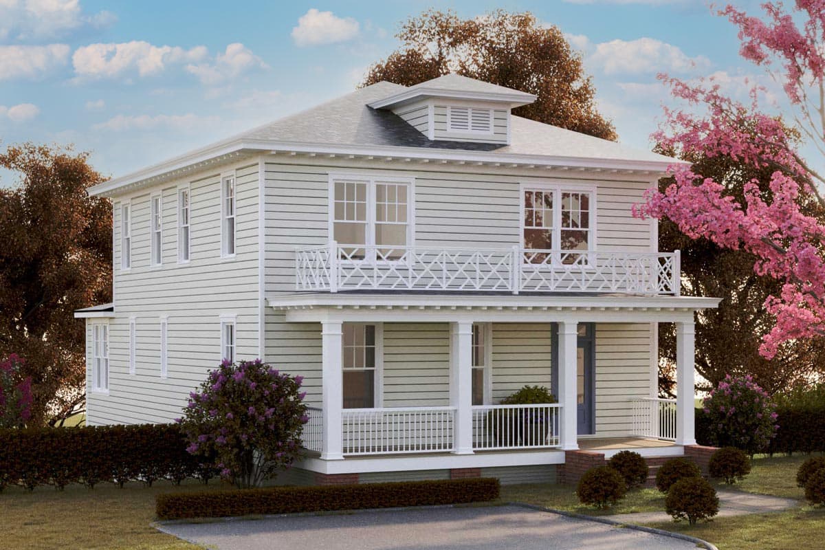 House plan exterior. Two-story with a second-story balcony and front porch. Features include a gable roof, decorative railing, and dormer.