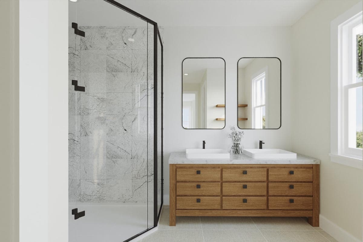 Bathroom with marble-look shower surround, double vanity with wood cabinetry, and two rectangular mirrors.