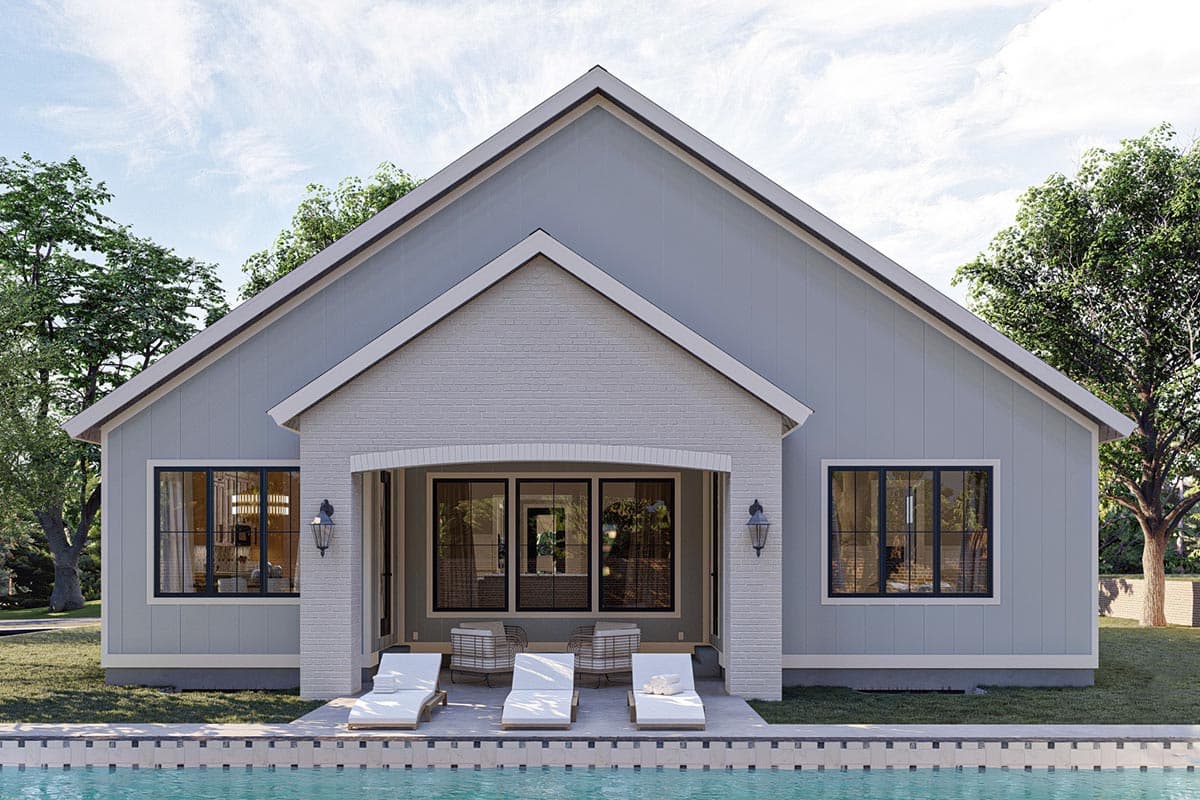 House plan exterior: Modern Farmhouse style, one-story, featuring a gabled roof, covered patio with brick accents, and large windows.